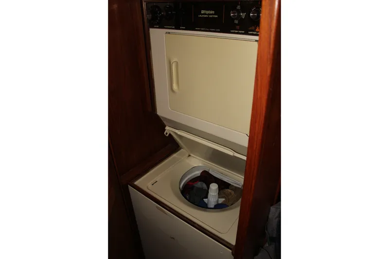Slide: The Image of Laundry area with Frigidaire washer in 1989 Californian 55 Cockpit Motor Yacht. - 29