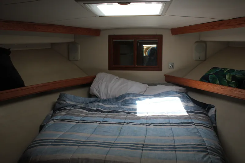 Slide: The Image of Cozy cabin interior of 1989 Californian 55 Cockpit Motor Yacht with bed and window. - 17