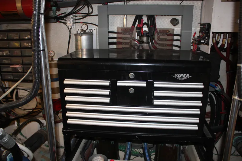 Slide: The Image of Engine room of 1989 Californian 55 Cockpit Motor Yacht with tool chest and wiring. - 24