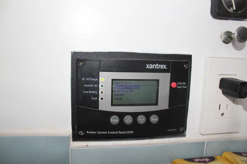 Slide: The Image of Xantrex system control panel on 1989 Californian 55 Cockpit Motor Yacht, displaying settings and indicators. - 16