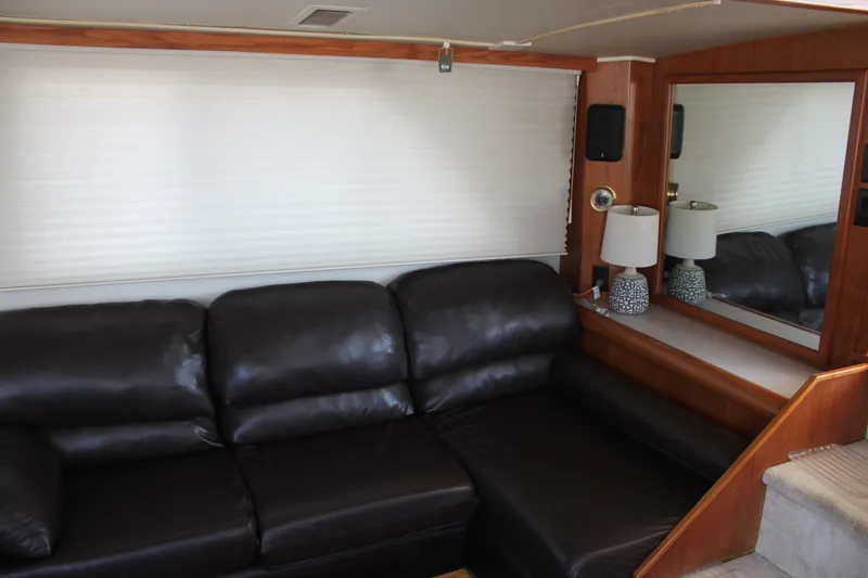 Slide: The Image of Luxurious interior of 1989 Californian 55 Cockpit Motor Yacht with leather seating and elegant decor. - 37