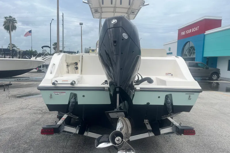 Slide: The Image of 2023 Cobia 237 Center Console boat on trailer, rear view with outboard motor. - 5