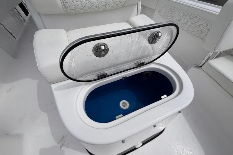 Slide: The Image of Livewell on 2027 Tidewater 2700 Carolina Bay boat, featuring sleek white seating and modern design. - 13