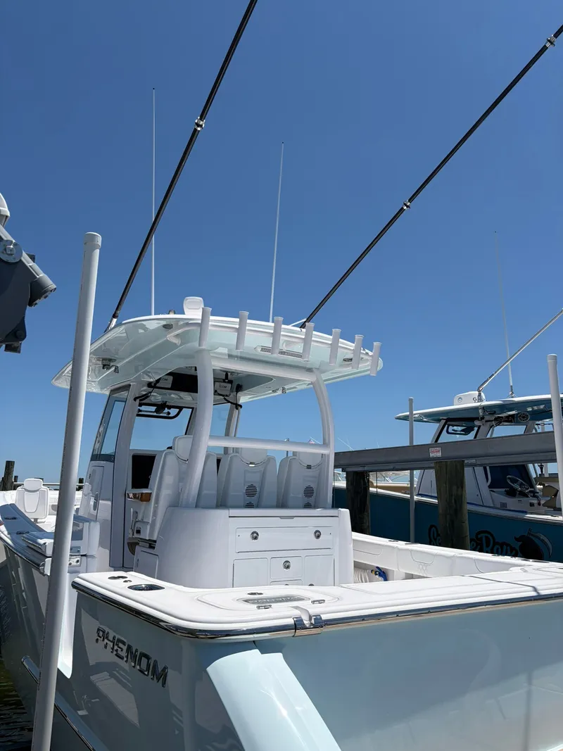 Slide: The Image of Phenom 34 boat from 2026 docked with a clear blue sky in the background. - 10