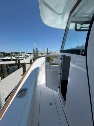 Slide: The Image of The 2026 Phenom 34 is docked. It features a sleek design with a glossy finish. - 14