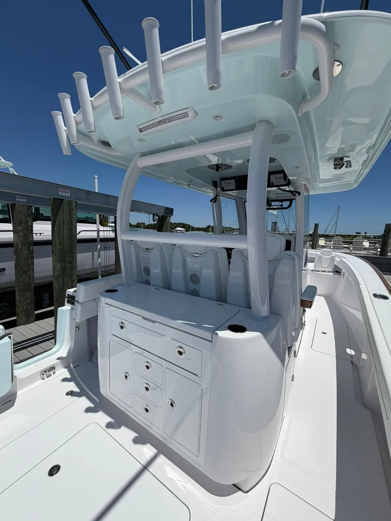 Slide: The Image of The image shows a modern boat with a spacious deck and multiple storage compartments. - 27