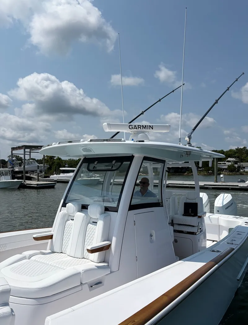 Slide: The Image of The image shows a modern boat, the Phenom 34, year 2026, with a sleek white design. - 33