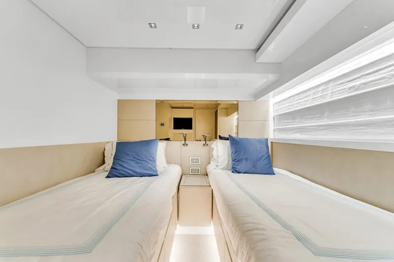 Slide: The Image of Twin cabin interior of 2018 Sanlorenzo SL78 yacht with modern design and blue accents. - 25