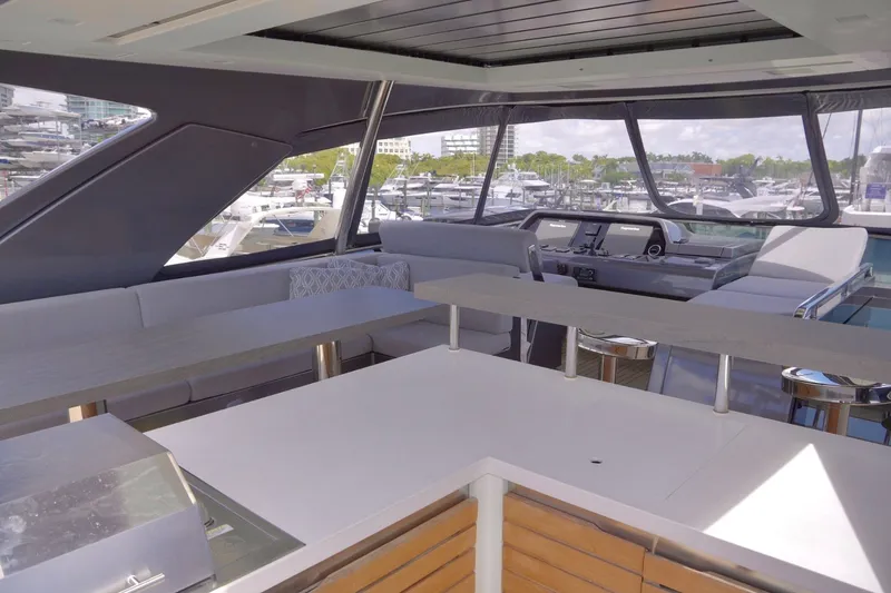 Slide: The Image of The 2018 Sanlorenzo SL78 features a modern flybridge with sleek seating areas and a helm station. - 45