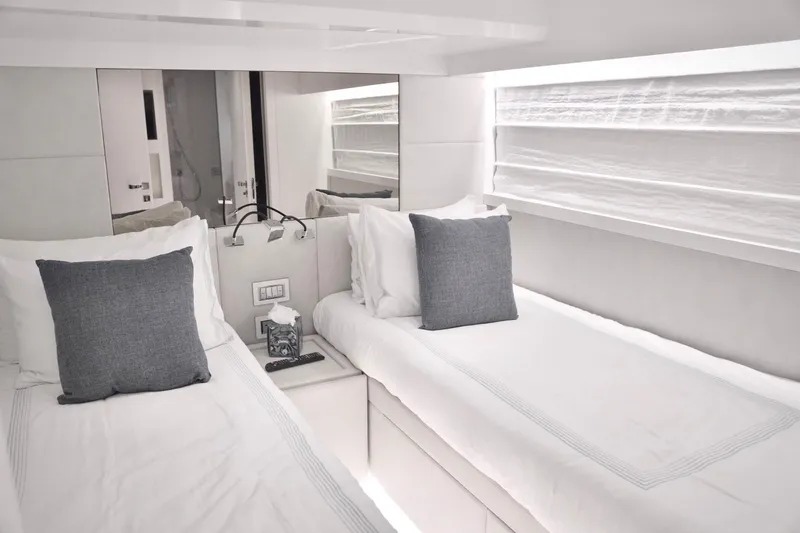 Slide: The Image of Luxurious twin cabin interior on 2018 Sanlorenzo SL78 yacht, featuring elegant bedding and modern design. - 32