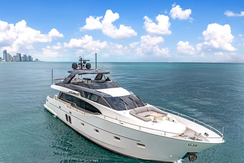 Slide: The Image of Luxurious 2018 Sanlorenzo SL78 yacht cruising near city skyline under blue sky. - 3