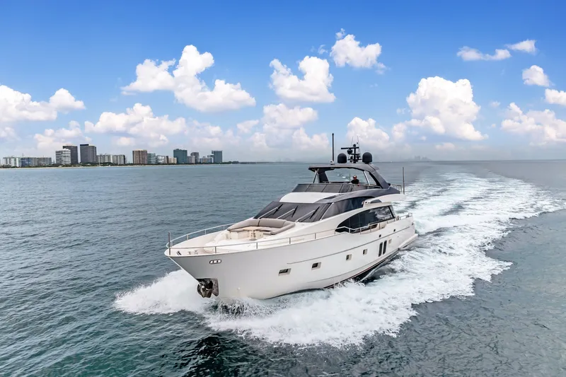 Slide: The Image of Sanlorenzo SL78 2018 yacht cruising on open water under a clear blue sky. - 2