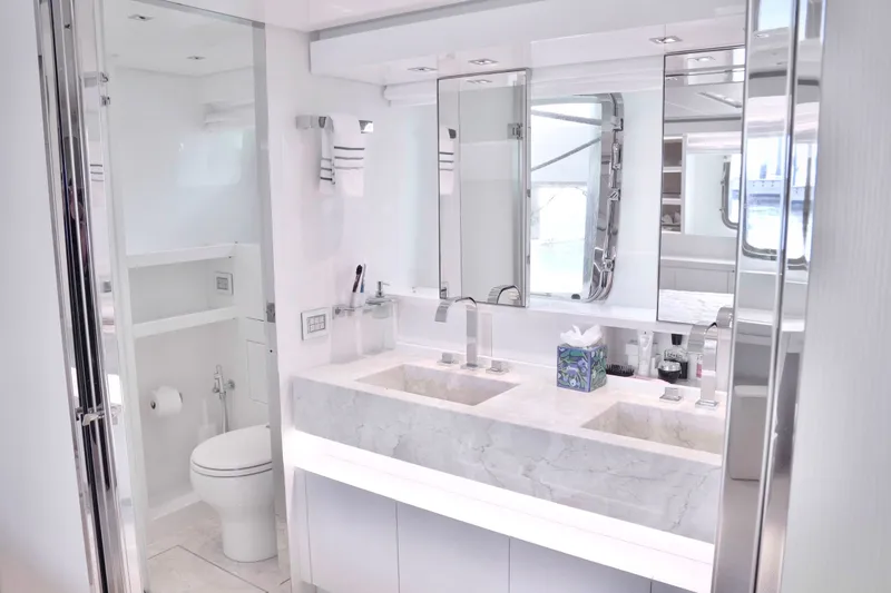Slide: The Image of Luxurious bathroom with double sinks, marble surfaces, and modern fixtures on a Sanlorenzo SL78 yacht. - 18