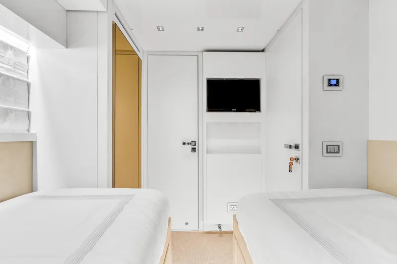 Slide: The Image of Luxurious Sanlorenzo SL78 2018 yacht cabin with twin beds and modern amenities. - 27