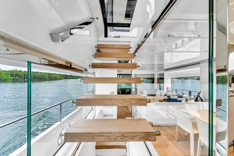 Slide: The Image of Modern interior of 2018 Sanlorenzo SL78 yacht with floating wooden staircase and scenic water view. - 10
