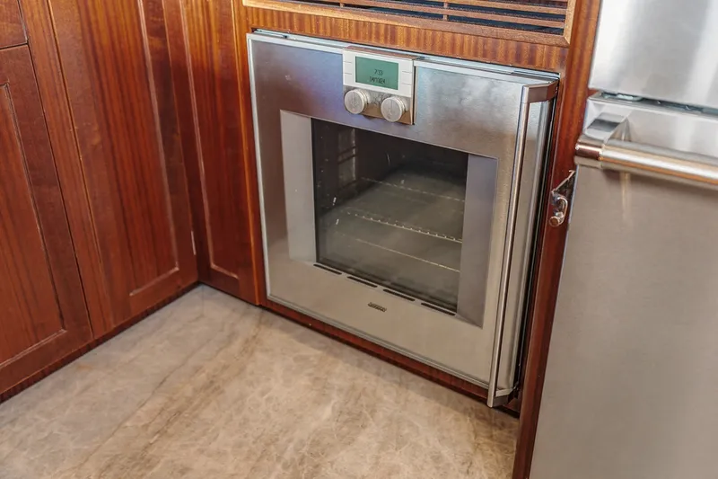 Slide: The Image of Stainless steel oven in 2013 Ocean Alexander 65 Pilothouse yacht kitchen. - 18