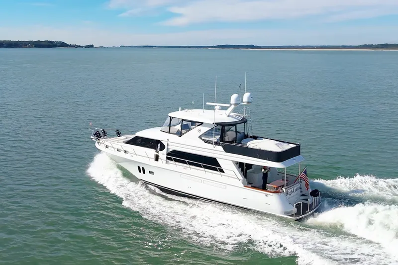 The Image of 2013 Ocean Alexander 65 Pilothouse yacht cruising on open water. - 0