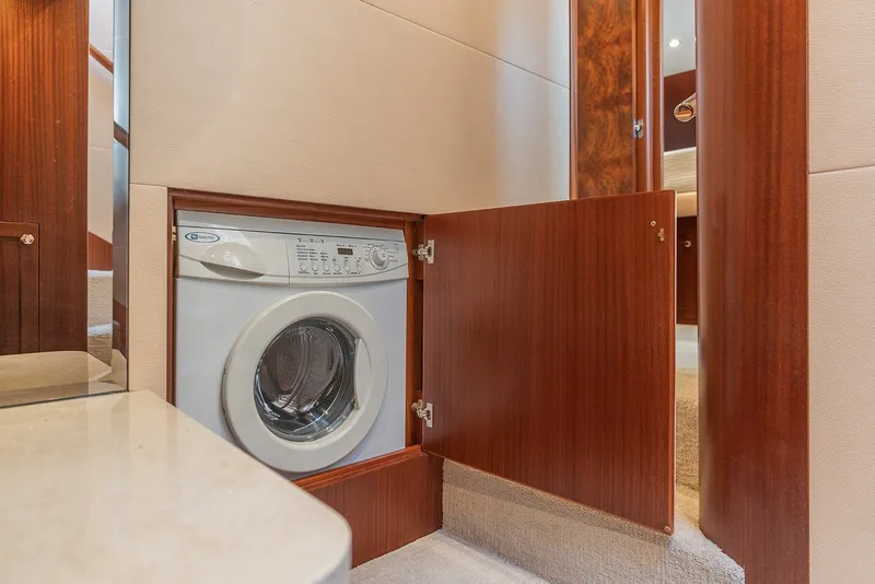 Slide: The Image of Laundry area with washing machine in 2013 Ocean Alexander 65 Pilothouse yacht. - 26