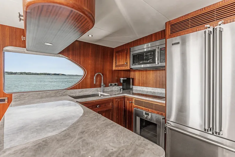 Slide: The Image of Luxurious kitchen interior of 2013 Ocean Alexander 65 Pilothouse yacht with modern appliances. - 17