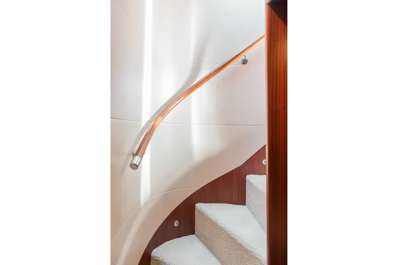 Slide: The Image of Staircase with wooden handrail on 2013 Ocean Alexander 65 Pilothouse yacht. - 24
