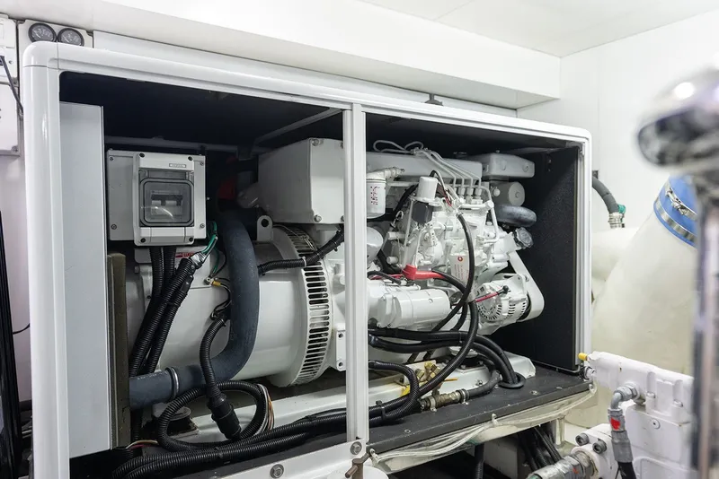 Slide: The Image of Engine room of 2013 Ocean Alexander 65 Pilothouse yacht, showcasing mechanical components. - 49