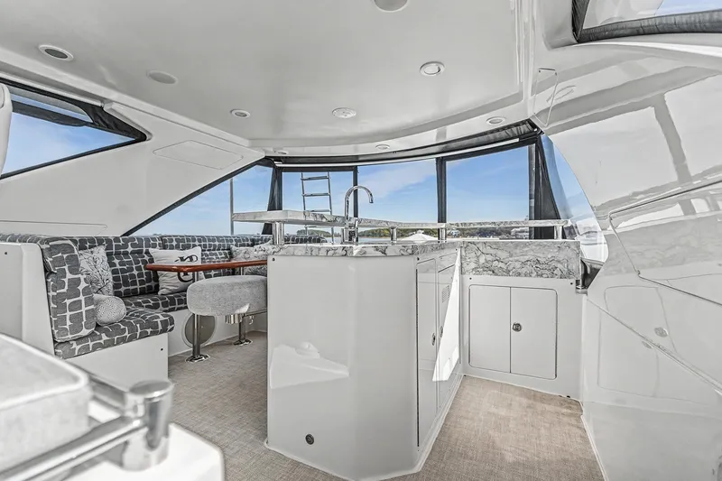 Slide: The Image of Luxurious interior of 2013 Ocean Alexander 65 Pilothouse yacht with modern seating and kitchenette. - 41