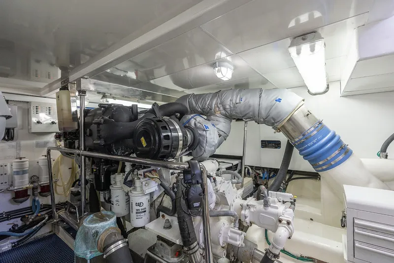 Slide: The Image of Engine room of 2013 Ocean Alexander 65 Pilothouse yacht, showcasing mechanical components. - 51