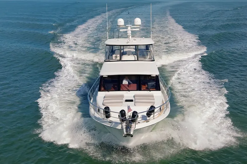 Slide: The Image of 2013 Ocean Alexander 65 Pilothouse yacht cruising on open water. - 4