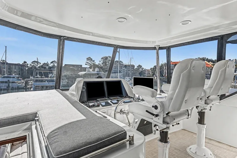 Slide: The Image of Pilothouse interior of 2013 Ocean Alexander 65, featuring modern helm and seating. - 38