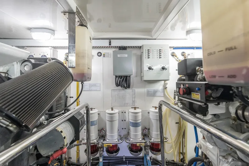 Slide: The Image of Engine room of 2013 Ocean Alexander 65 Pilothouse yacht, showcasing machinery and control panels. - 45