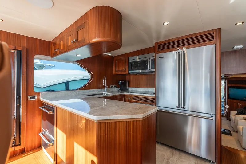 Slide: The Image of Luxurious kitchen interior of 2013 Ocean Alexander 65 Pilothouse yacht with modern appliances. - 22
