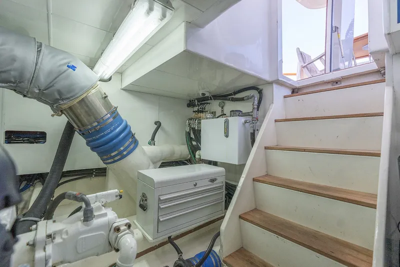 Slide: The Image of Engine room of 2013 Ocean Alexander 65 Pilothouse yacht with stairs and equipment. - 44