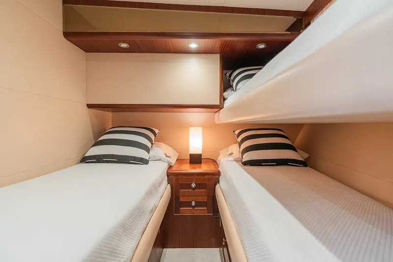 Slide: The Image of Cozy twin cabin with striped pillows on 2013 Ocean Alexander 65 Pilothouse yacht. - 36