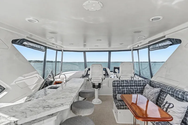 Slide: The Image of Luxurious interior of 2013 Ocean Alexander 65 Pilothouse yacht with panoramic windows and elegant seating. - 3