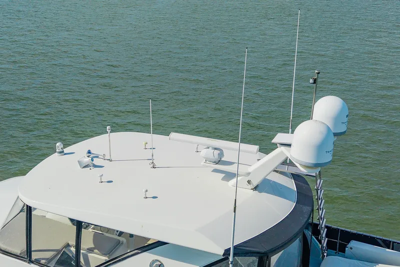 Slide: The Image of 2013 Ocean Alexander 65 Pilothouse yacht with advanced radar equipment on the roof. - 5