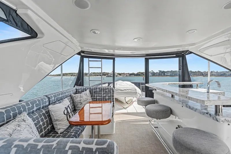 Slide: The Image of Luxurious interior of 2013 Ocean Alexander 65 Pilothouse yacht with elegant seating and bar area. - 40