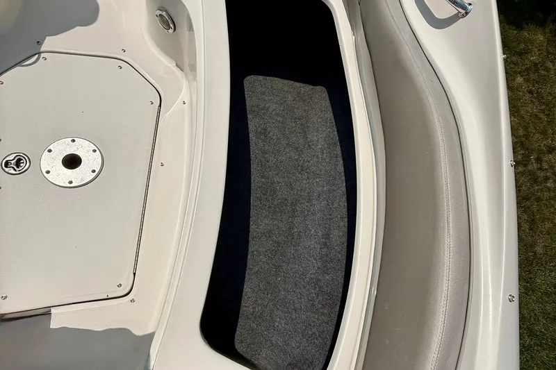 Slide: The Image of 2005 Sea Ray 270 Sundeck interior showing seating and storage compartment. - 13