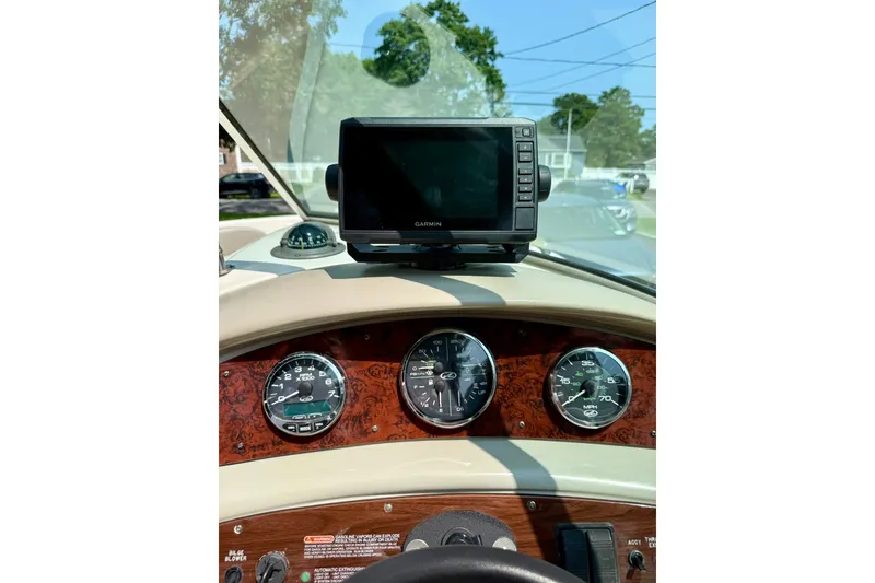 Slide: The Image of Dashboard of a 2005 Sea Ray 270 Sundeck with Garmin GPS and gauges. - 8