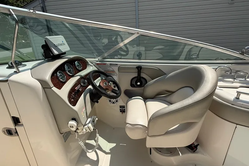 Slide: The Image of 2005 Sea Ray 270 Sundeck helm with Garmin navigation and comfortable seating. - 5