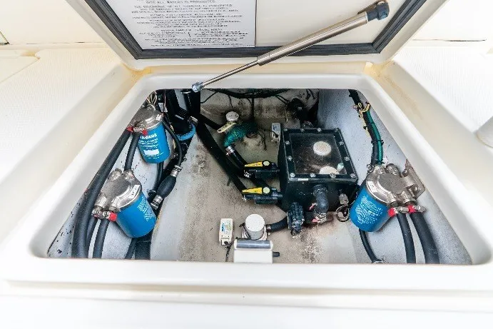 Slide: The Image of Engine compartment of a 2020 SeaVee 340Z boat, showcasing fuel filters and mechanical components. - 53