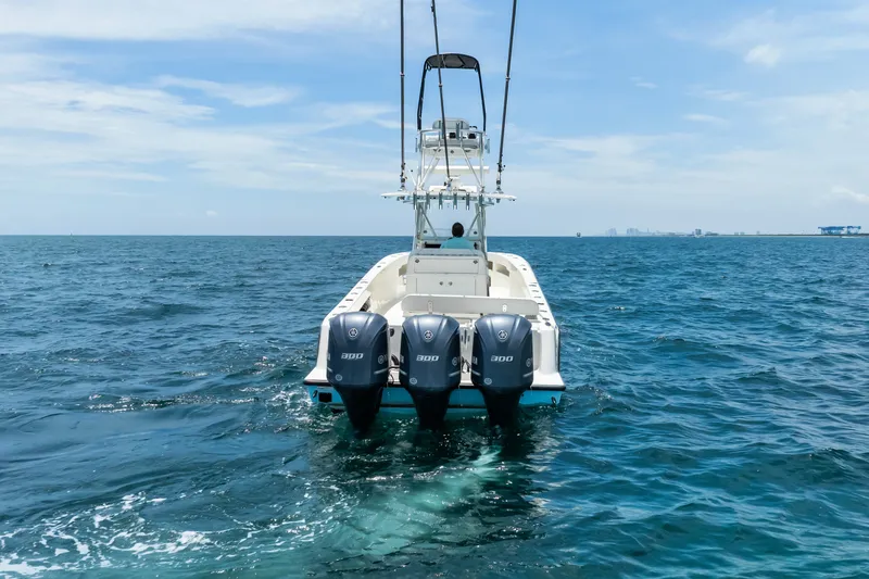 Slide: The Image of 2020 SeaVee 340Z boat with triple engines on open ocean. - 17