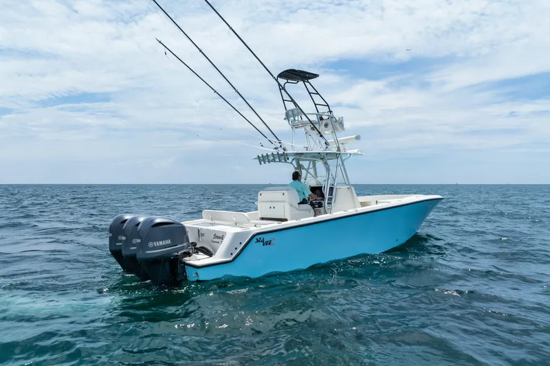 Slide: The Image of 2020 SeaVee 340Z boat with dual Yamaha engines on open ocean. - 10