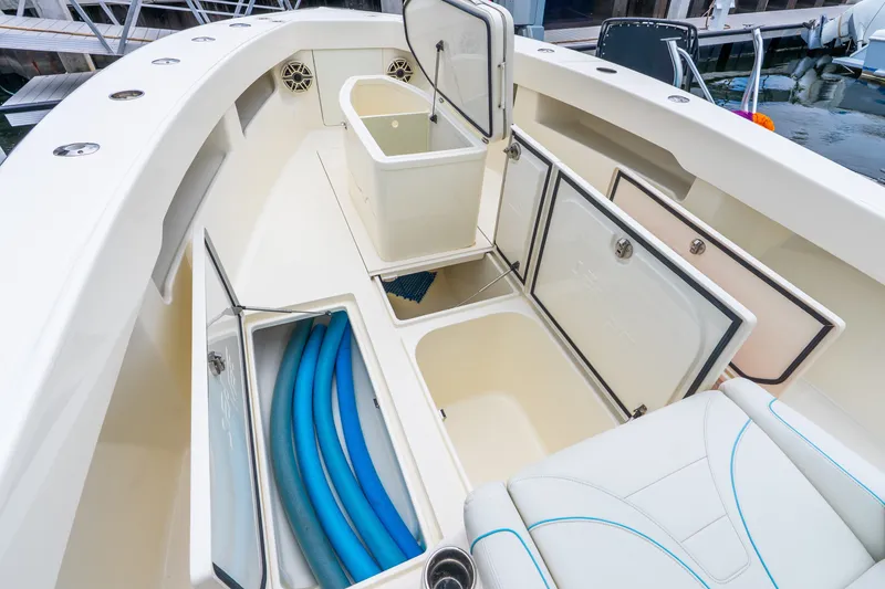 Slide: The Image of 2020 SeaVee 340Z boat interior with open storage compartments and seating. - 34