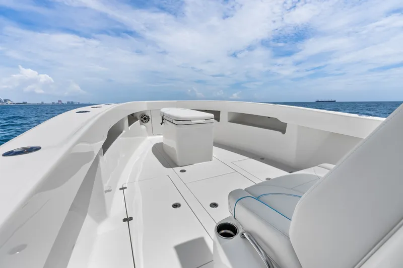 Slide: The Image of 2020 SeaVee 340Z boat deck with seating, ocean view, and clear sky. - 19