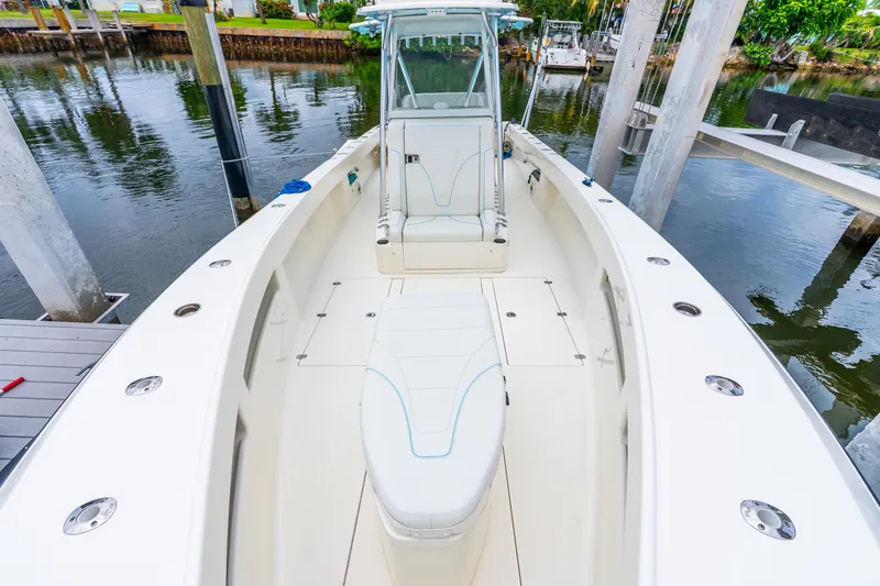 Slide: The Image of 2020 SeaVee 340Z boat interior, docked, showcasing spacious seating and sleek design. - 31