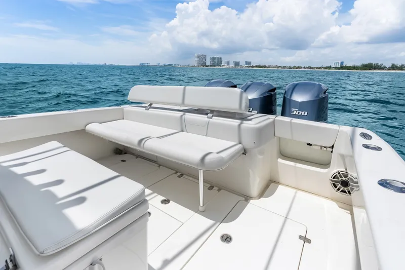 Slide: The Image of 2020 SeaVee 340Z boat interior with seating, ocean view, and twin engines. - 45
