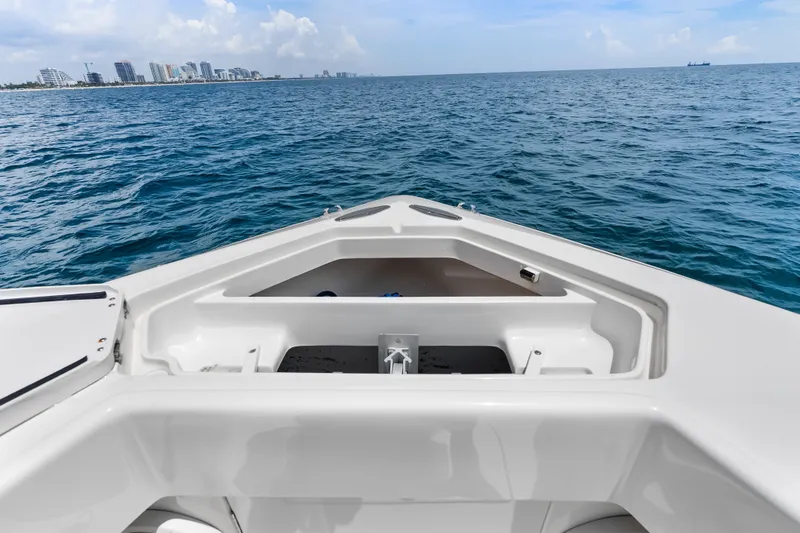 Slide: The Image of 2020 SeaVee 340Z boat on ocean, city skyline in background. - 20