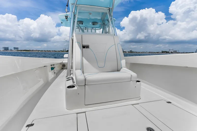 Slide: The Image of 2020 SeaVee 340Z boat interior with white seating, ocean view, and blue sky. - 22