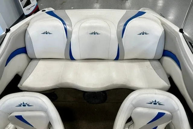 Slide: The Image of 2007 Mariah SX18 boat interior with white and blue seating. - 15
