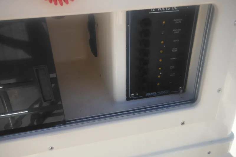 Slide: The Image of Control panel of a 2001 Parker 1801 Center Console boat, featuring various switches. - 29